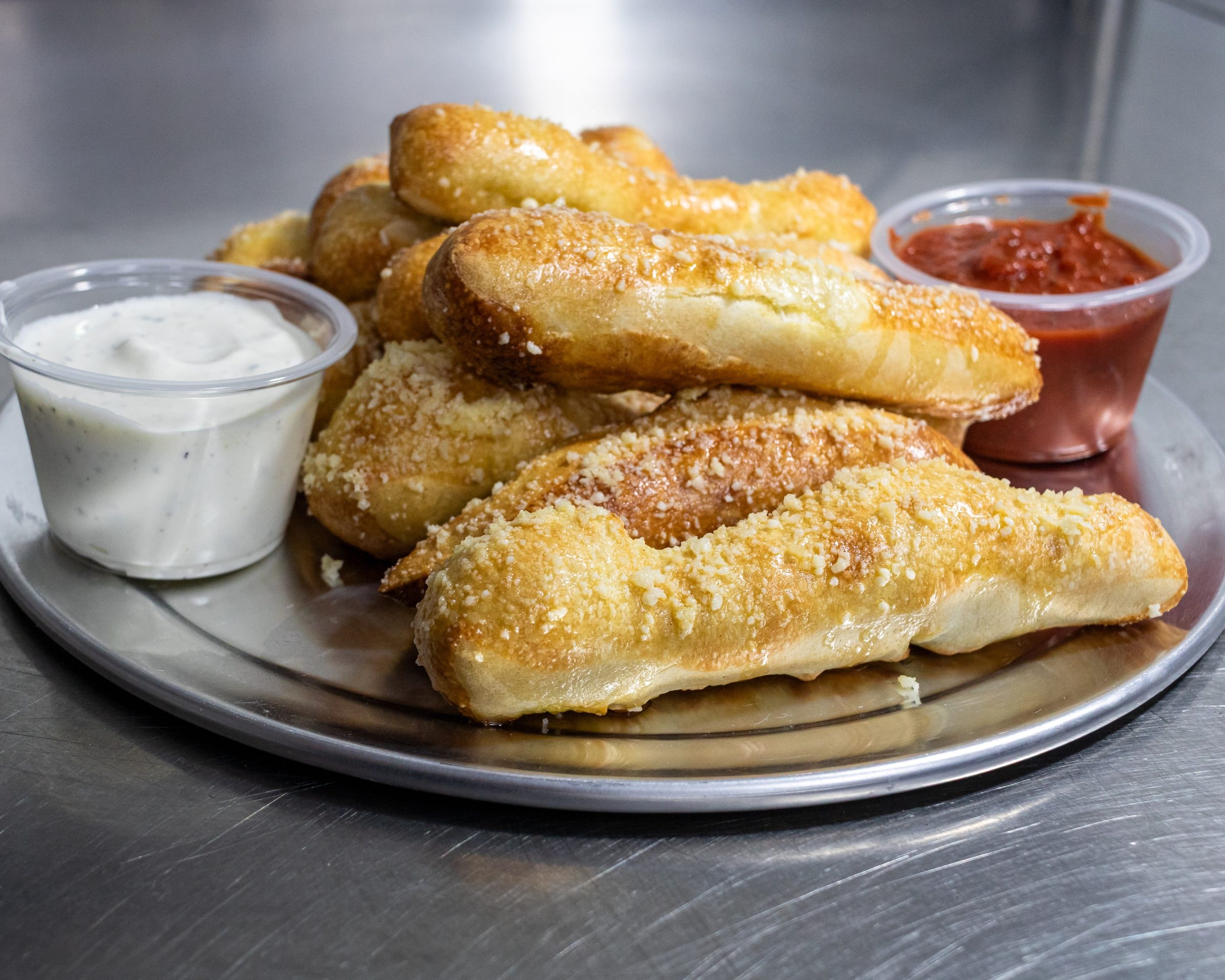 Large 1-topping pizza with 10 breadsticks from Pauli's Pizza